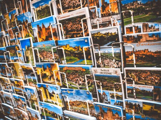 Postcards displayed on a wall