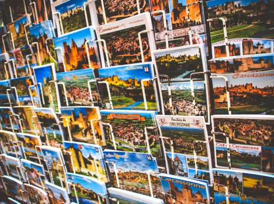 Postcards displayed on a wall